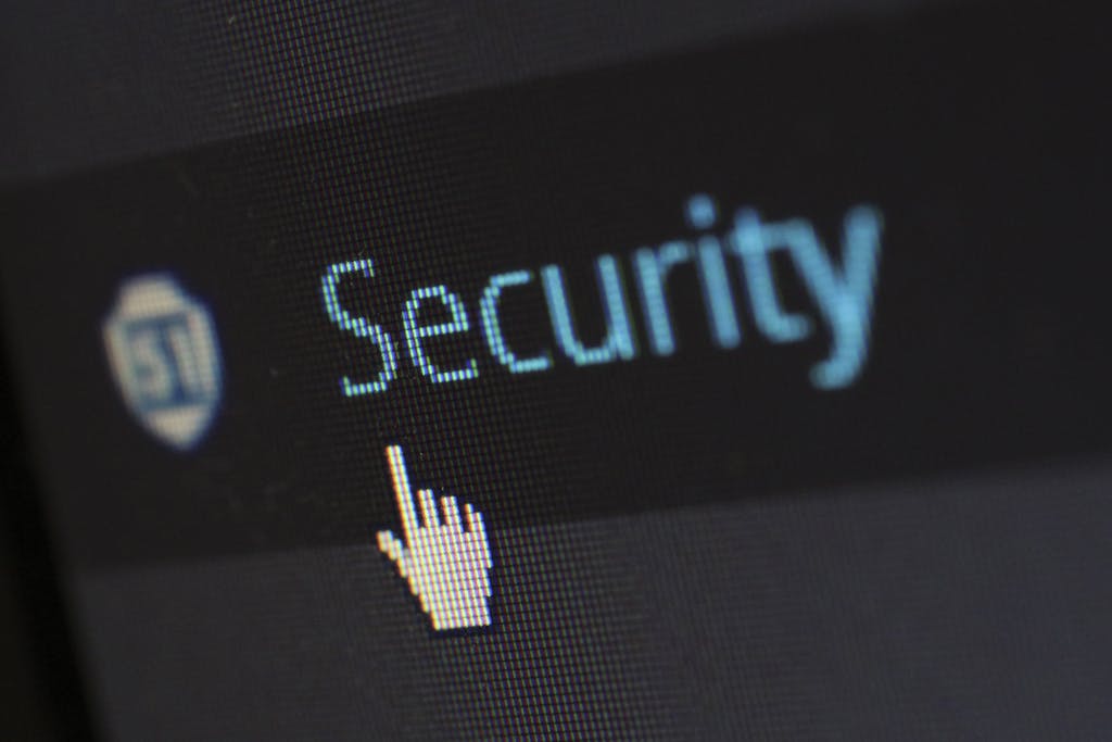 6 Teknologi Smart Home yang Mengubah Interior Rumah Mewah Jadi Masa Depan 3 Close-up view of a mouse cursor over digital security text on display.