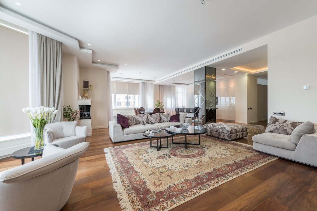 Spacious, modern living room with elegant decor and plush furniture.
