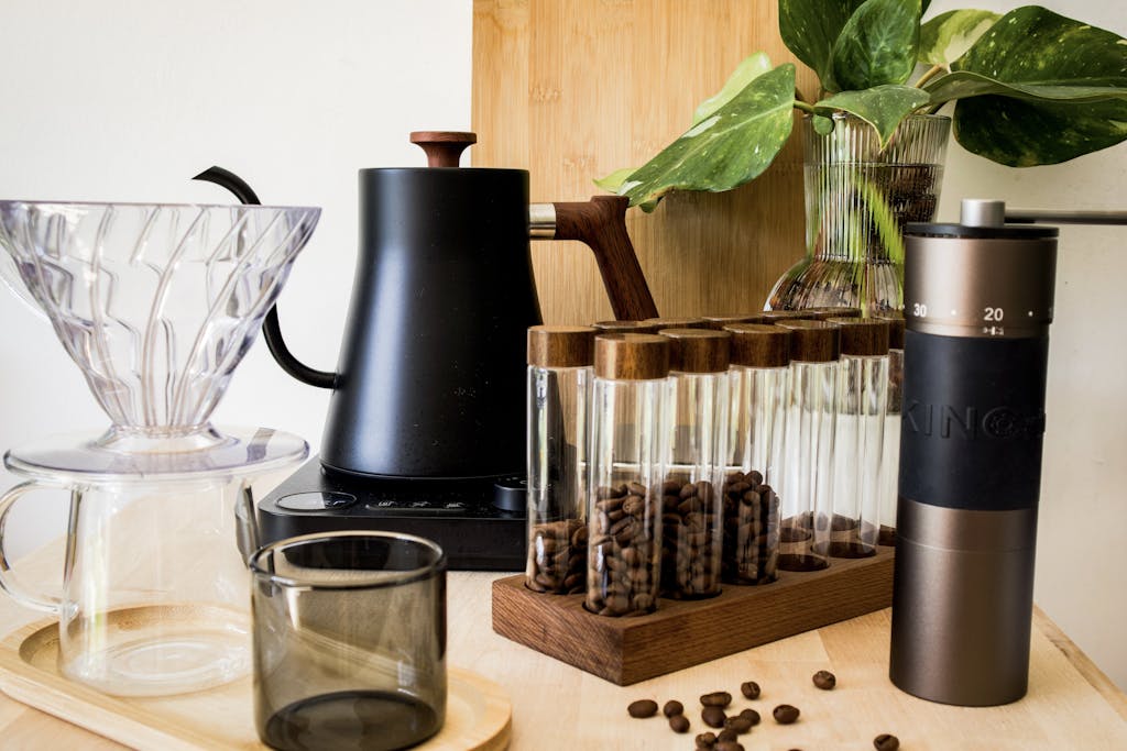 Stylish coffee brewing setup with kettle, grinder, and glassware. Perfect for home baristas.